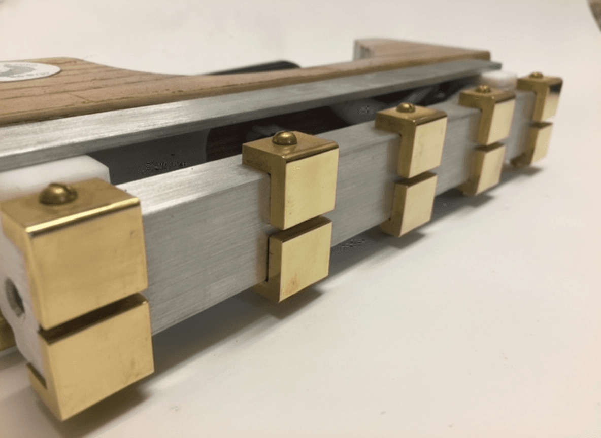 Polished brass stamp pads on a hand-built stamping iron