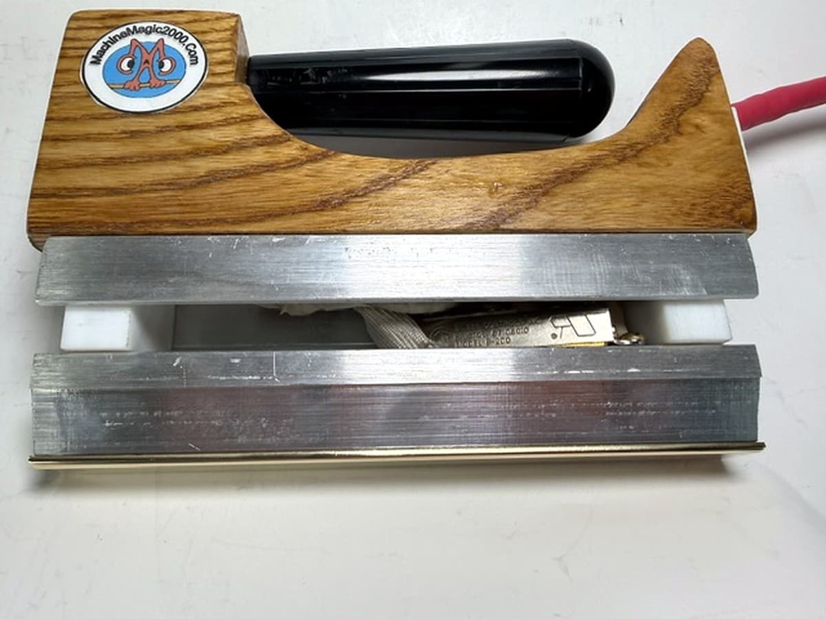 MM 3DLXM Deluxe mini solid bar iron with its polished brass bar and no rear power switch