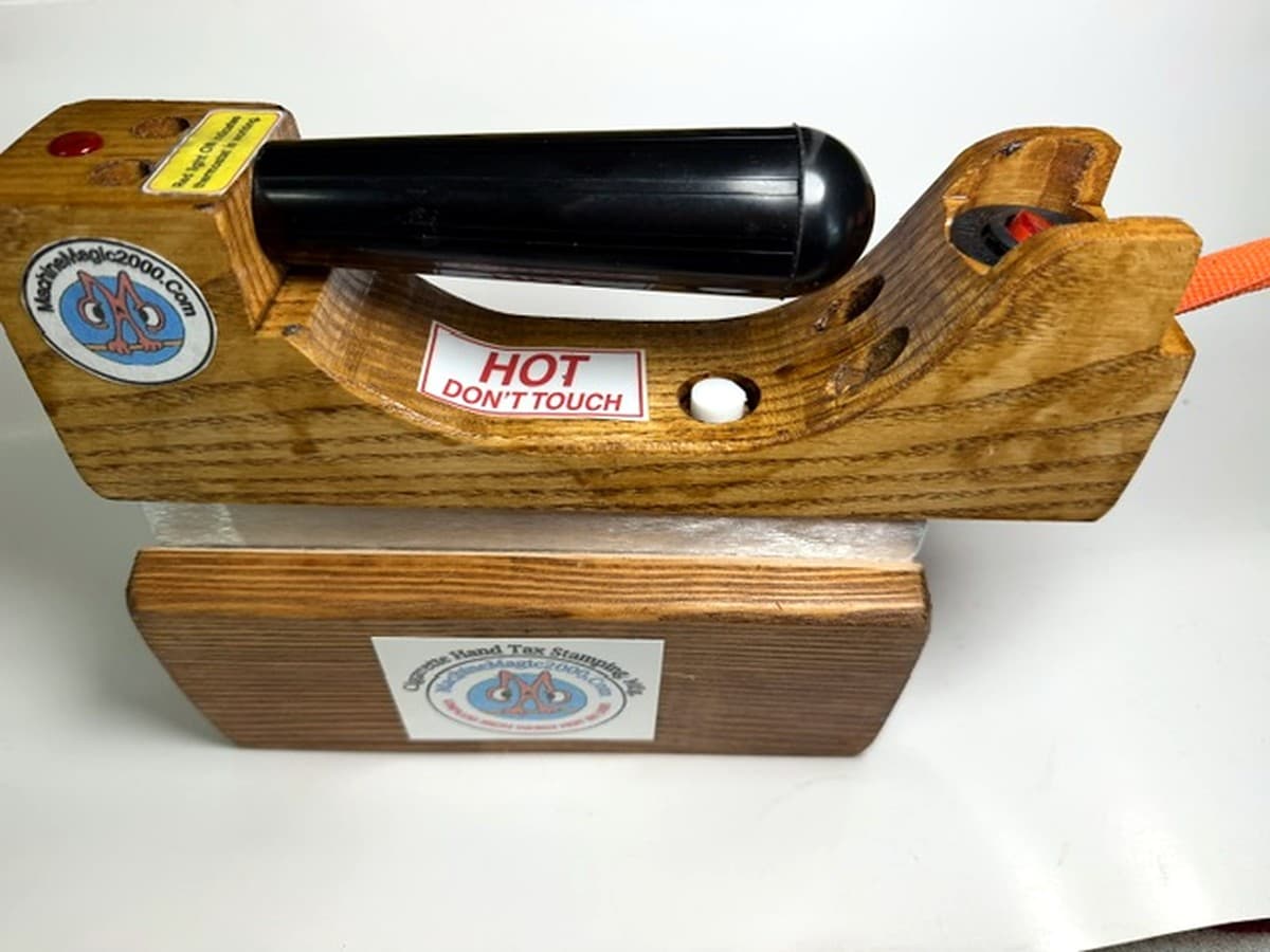 MM 3DLXPLUS Deluxe Plus mini solid bar iron with its rear illuminated on/off power switch
